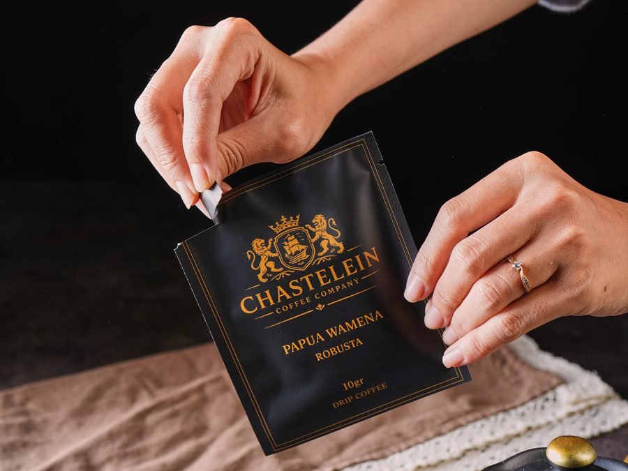 A single Chastelein sachet on a stone surface