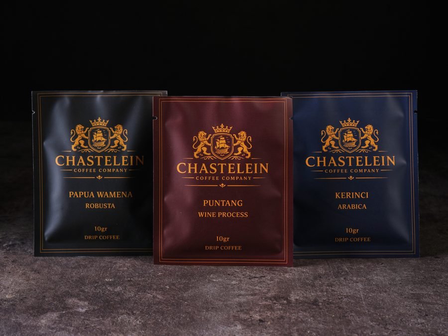 Three Chastelein sachets on stone with mountains behind