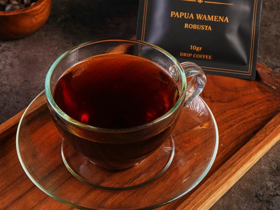 Coffee served on the deck of a Phinisi at sunrise